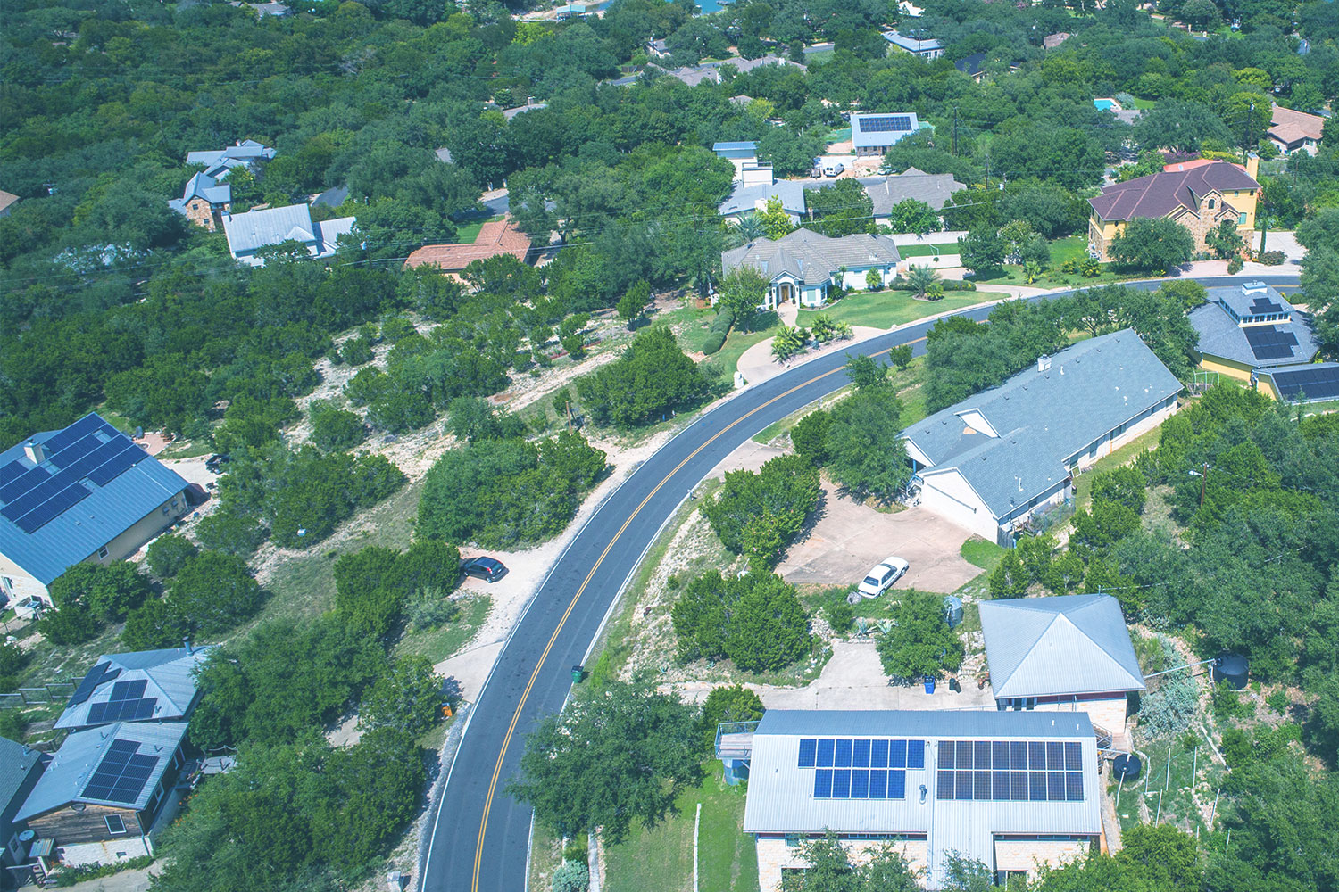 Aerial view of residential houses with solar panels